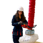 Operator using Adria tube lifter in industrial setting