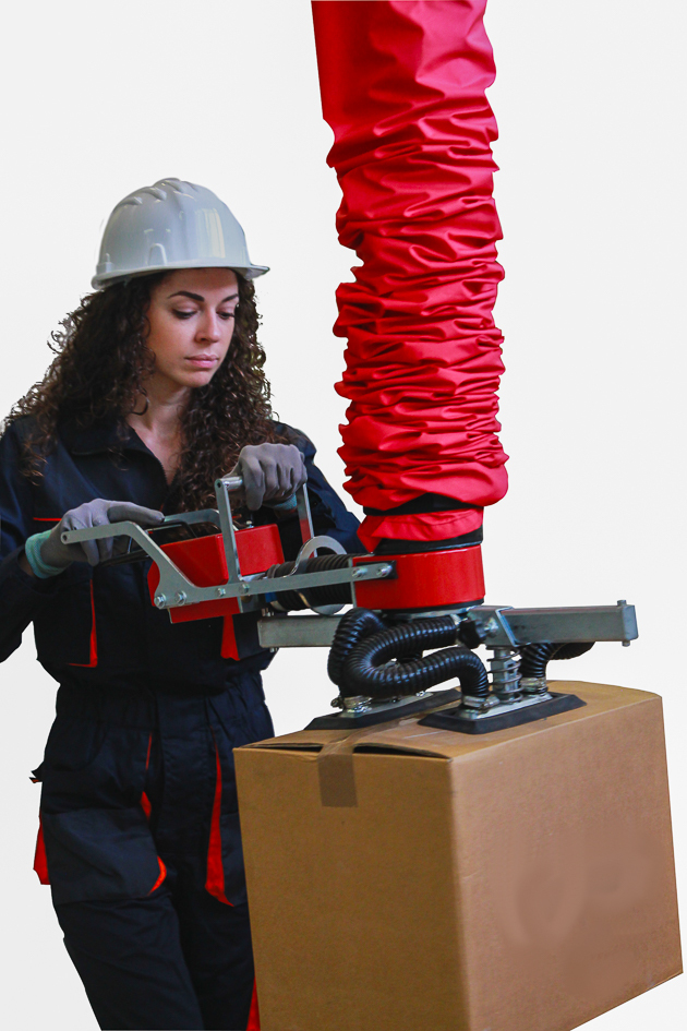 vacuum tube lifters lifting boxes in a warehouse line